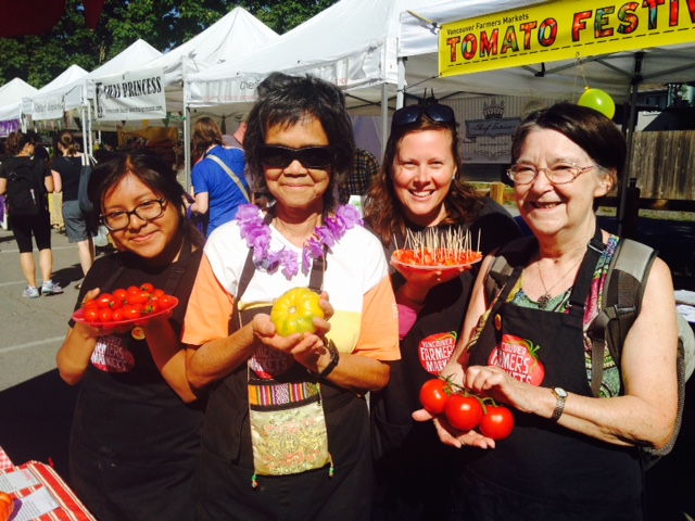 Tomato Fest volunteers displayed and samples so many tomatoes! Get them while they're ripe!